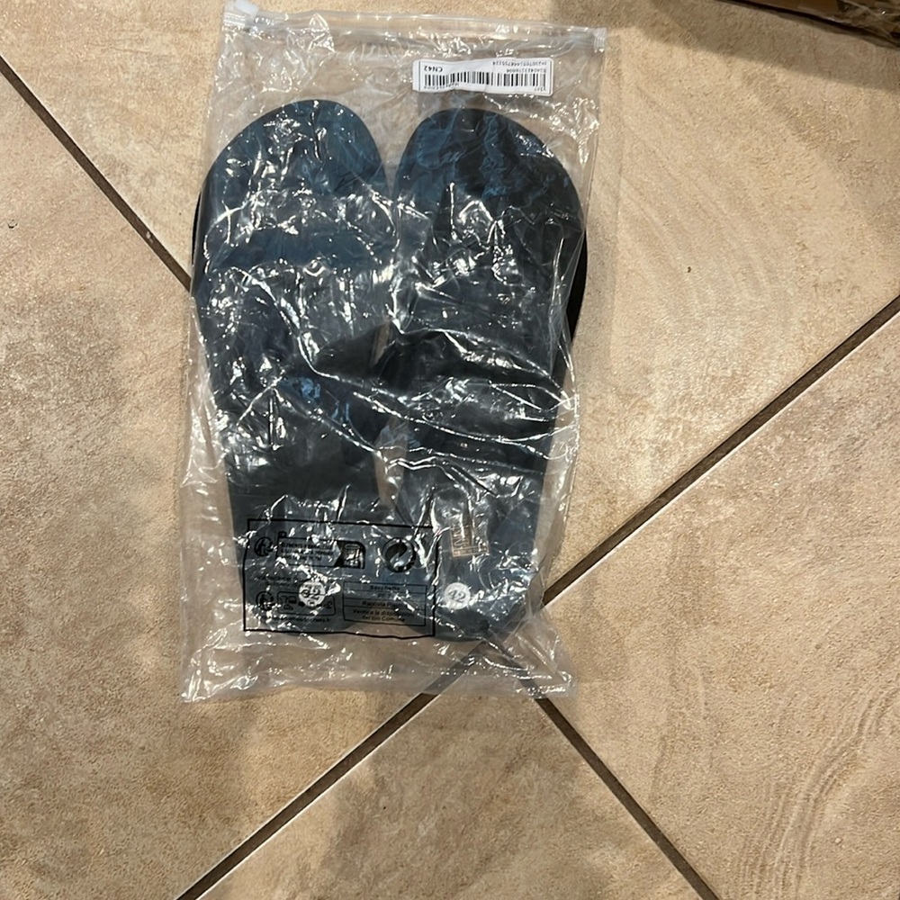 All black flip flops.